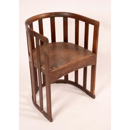 1310 - An Arts & Crafts mahogany barrel chair, in the manner of Liberty & Co, curved cresting rail above a ... 