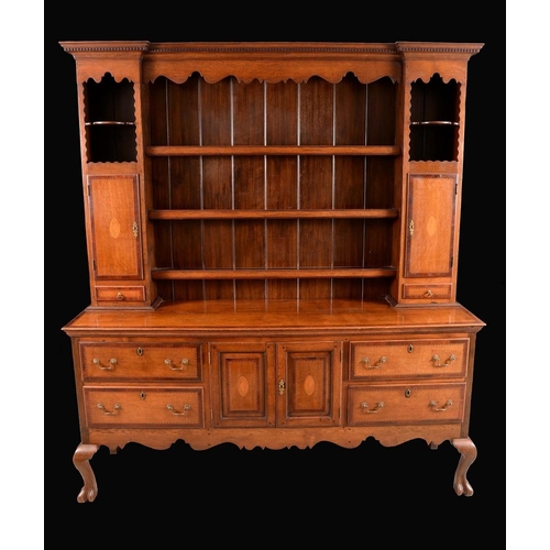 1323 - An 18th century style mahogany crossbanded oak dresser, dentil cornice above a shaped frieze and an ... 