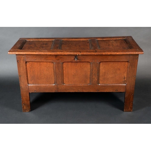 1324 - An 18th Century oak three panel blanket chest, hinged top, stile feet, 70cm high, 125cm wide, c.1720