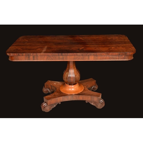 1345 - A William IV rosewood rounded rectangular centre table, slightly oversailing top above a deep frieze... 