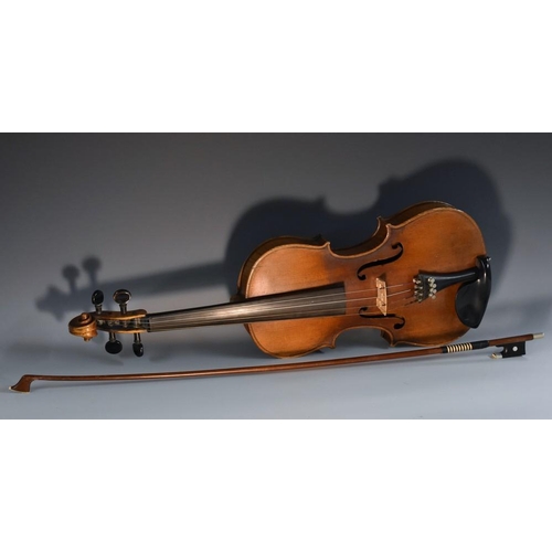 1352 - A violin, the two-piece back 35.5cm long excluding button, ebonised tuning pegs, outlined throughout... 