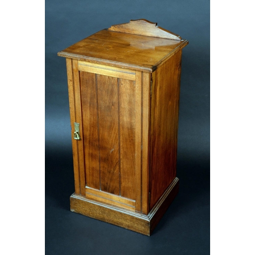 1353 - A Victorian walnut pot cupboard, shaped cresting, oversailing top above a rectangular plank-panelled... 