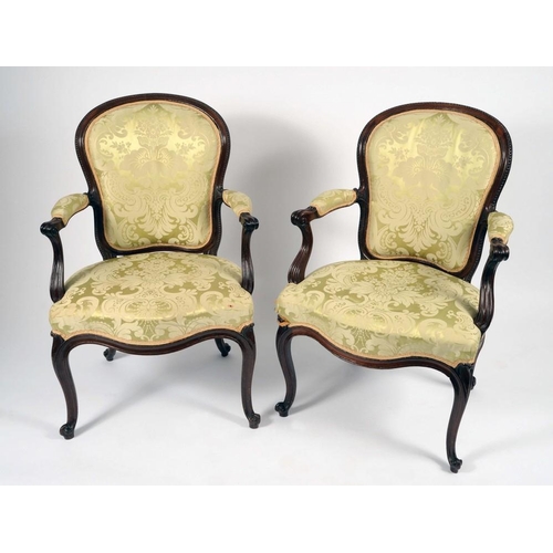 1361 - A pair of George III French Hepplewhite mahogany elbow chairs, cartouche shaped backs with beaded bo... 