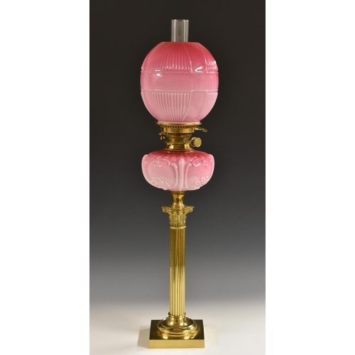 1363 - A Victorian opaque cranberry glass and gilt-brass oil lamp, Hinks No. 1 Safety, fluted ovoid shade m... 