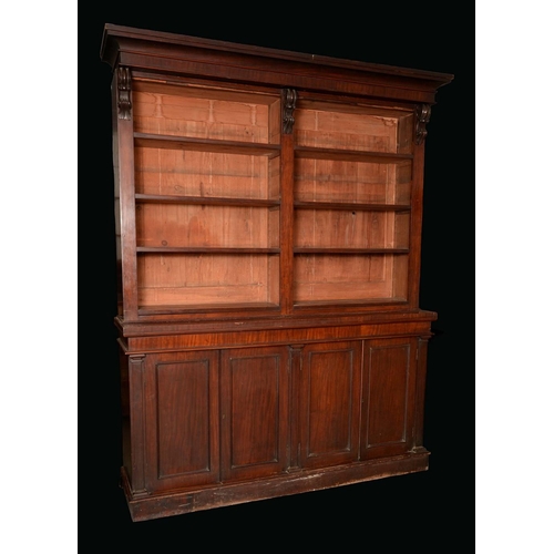 1367 - A Victorian mahogany library bookcase, outswept cornice above two rows of adjustable open shelves di... 