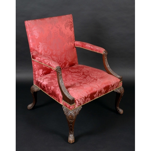 1369 - A George III mahogany Gainsborough armchair, serpentine arms, stuffed over damask upholstery, cabrio... 