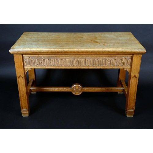 1373 - A Victorian Gothic Revival oak side table, moulded top above a deep frieze carved with a verse, H-st... 