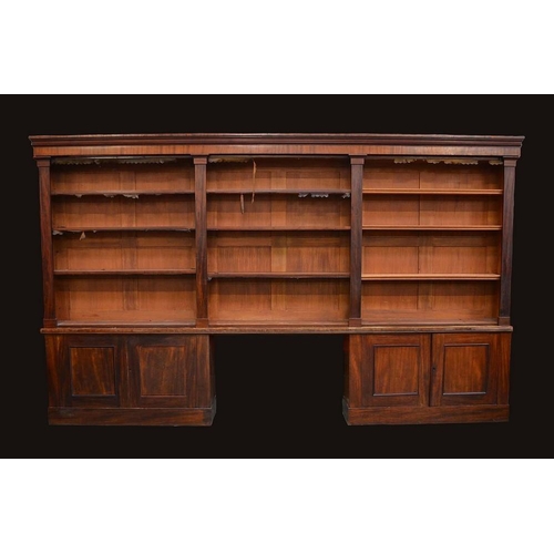 1402 - A substantial Victorian mahogany library bookcase, moulded cornice above two rows of adjustable shel... 