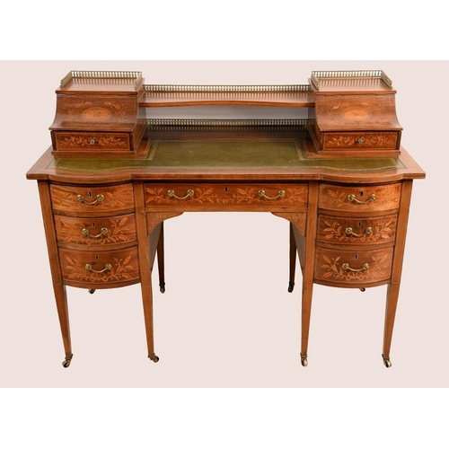 1409 - A Sheraton revival mahogany and marquetry Carlton House desk, the superstructure with a pair of hing... 