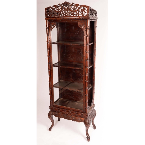 1411 - A Chinese padouk wood display cabinet, shaped pierced cresting above a glazed rectangular door enclo... 