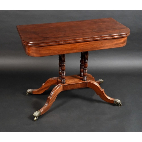 1425 - A Regency mahogany rounded rectangular card table, folding top enclosing an inset baize lined playin... 