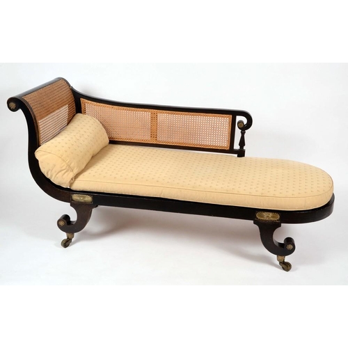 1426 - A Regency design ebonised bergere day bed, the back and end support terminating in scrolls, squab cu... 