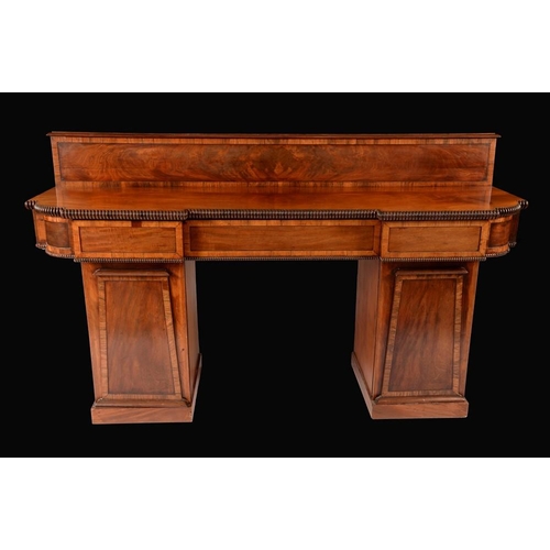 1432 - A post-Regency mahogany inverted break-centre sideboard, possibly Scottish, slightly oversailing top... 