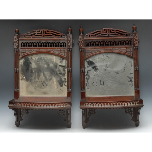 1450 - A pair of Gothic Chippendale Revival mahogany wall brackets, each with pierced cresting above an arc... 