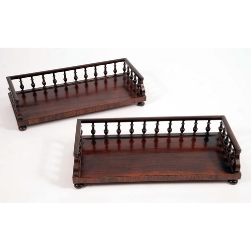 1452 - A pair of 'George IV' rosewood bookstands, each with three quarter balustrade gallery, bun feet, 48c... 