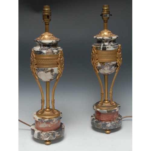 1454 - A pair of Empire design marble and gilt metal urnular table lamps, each with three lion paw supports... 