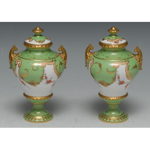 158 - A pair of Royal Crown Derby urnular pedestal vases with covers, decorated with floral swags, apple g... 