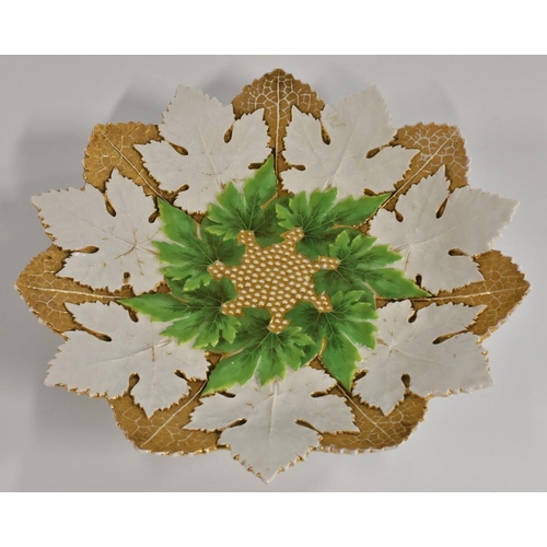 238 - A Meissen leaf shaped plate, in relief with vine leaves, picked out in gilt and green, 29cm wide, cr... 