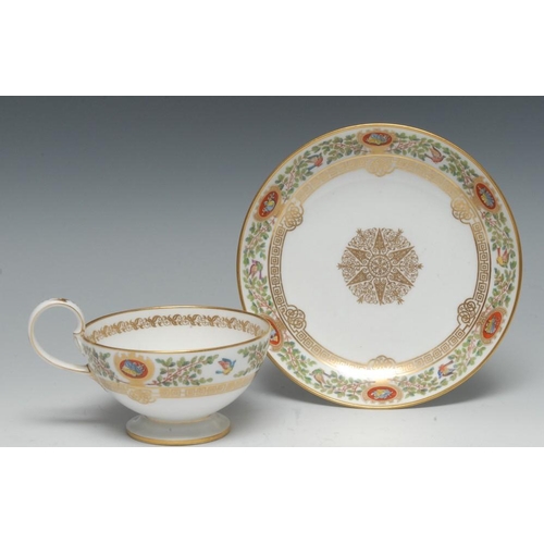 253 - A mid 19th century Louis Phillippe Sevres Chateau Fontainebleau tea cup and saucer, painted with bir... 