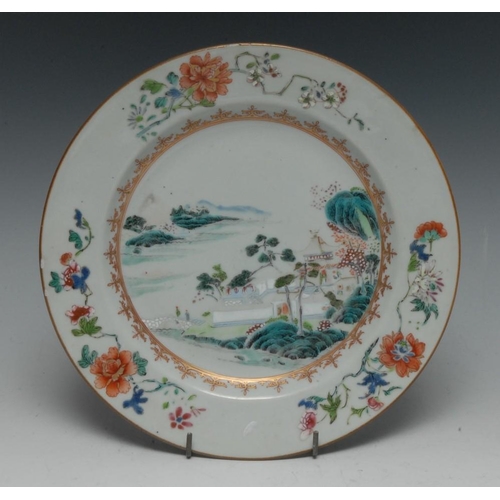 315 - A Chinese circular plate, decorated in famille rose palette with figures, pagodas and foliage, 22cm ... 