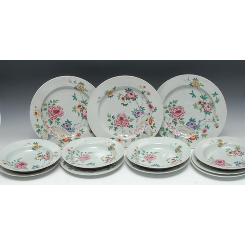 321 - A Chinese famille rose part service, comprising three circular plates, four bowls and five 23cm plat... 