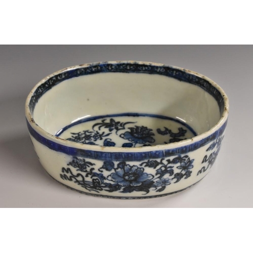 354 - An 18th century Chinese porcelain oval butter tub, decorated in tones of underglaze blue with flower... 