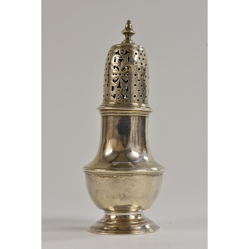 497 - A George II silver half-fluted baluster caster, knop finial, pierced bell shaped cover engraved with... 