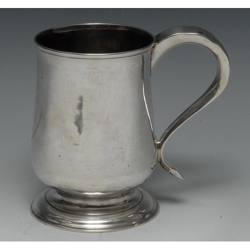 502 - A George III Provincial silver bell shaped pint mug, scroll capped handle, skirted base, 13.5cm high... 