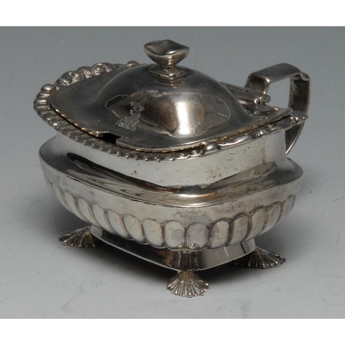 511 - A George III silver half-fluted boat shaped mustard, hinged domed cover, gadrooned borders, shell fe... 