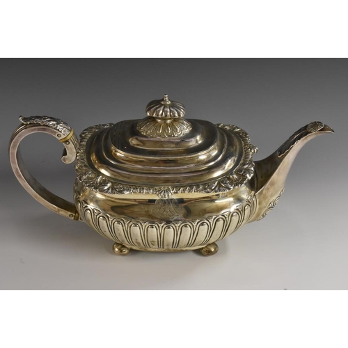 512 - A George III silver half-fluted boat shaped teapot, hinged cover, gadrooned acanthus border, scroll ... 