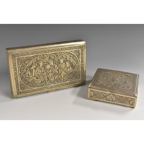 588 - A Persian silver rectangular box, hinged cover chased with musicians, on a ground of stylised foliag... 