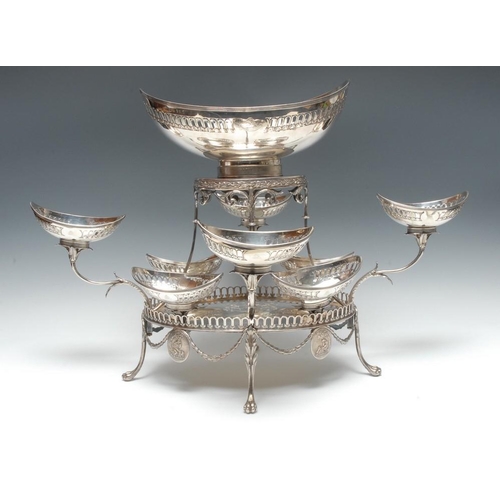 598 - A substantial George III Neo-Classical silver table centre epergne, the central navette shaped baske... 