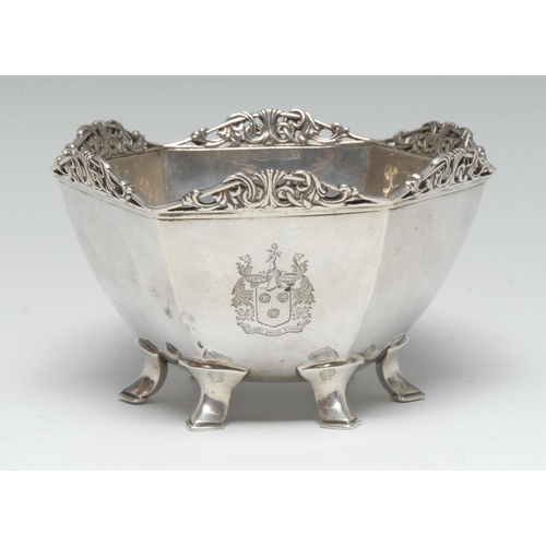 681 - Omar Ramsden - an Arts and Crafts silver hexagonal bowl, shaped cresting pierced and cast with scrol... 