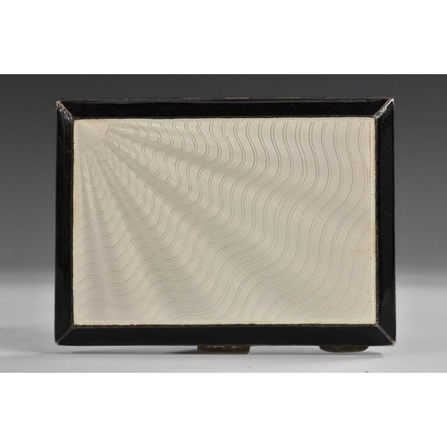 692 - An Art Deco silver and enamel rectangular cigarette case, hinged cover engine turned with radiating ... 