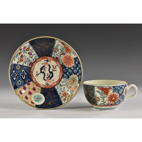 74 - A Worcester Old Mosaic pattern teacup and saucer, richly painted and gilded with alternating floweri... 