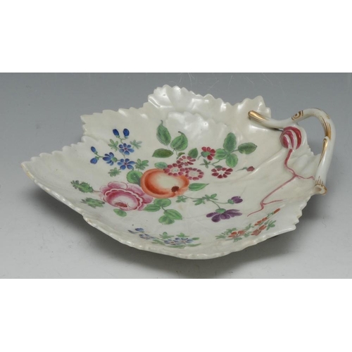 78 - A Worcester leaf moulded dish, branch handle, painted in the manner of James Giles, with whole fruit... 