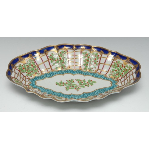 81 - A Worcester Hop Trellis pattern lobed oval plate, painted with pendant boughs of red-berried hops al... 