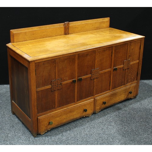 387 - A 20th century oak kitchen sideboard, bevelled half gallery above a rectangular top, three cupboard ... 