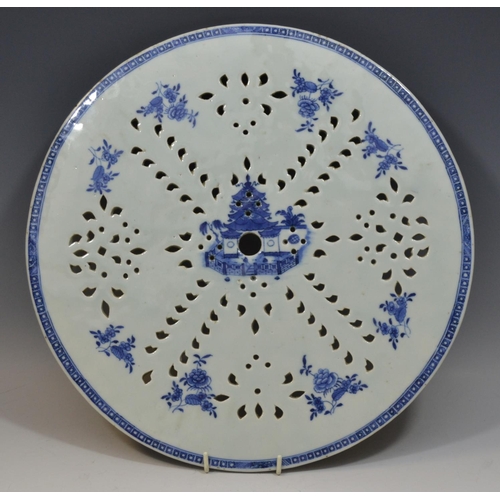 108 - A Chinese strainer plate, pierced, printed in underglaze blue with pagoda and stylised flowers and f... 