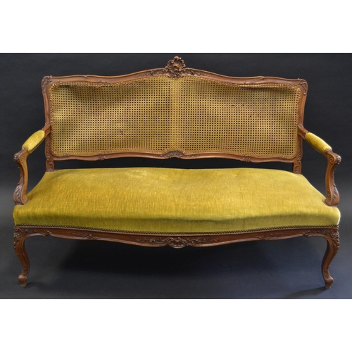 780 - A late 19th century French walnut and bergere salon sofa, carved shell cresting rail, velvet upholst... 