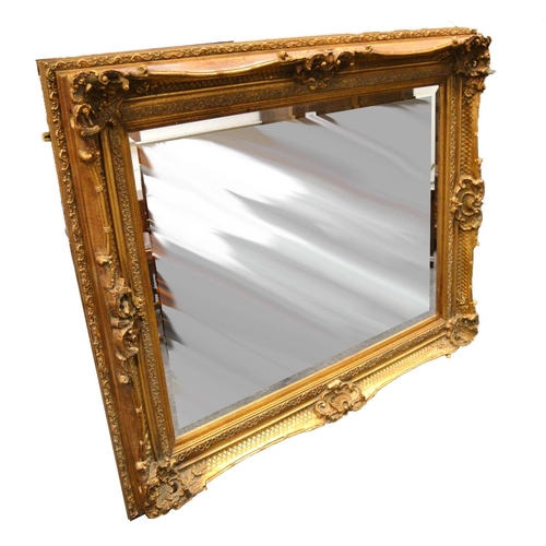 783 - A substantial giltwood bevel edged mirror