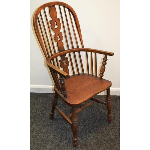 792 - A 19th century elm kitchen chair, pierced vasular splat, H stretcher