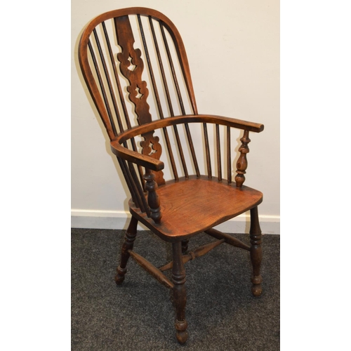 793 - A 19th century elm kitchen chair, pierced vasular splat, H stretcher