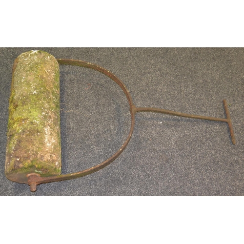 796 - A stone and cast iron garden lawn roller, arched iron body and handle, 72cm x 41cm