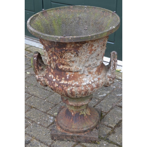 797 - A Victorian cast iron campana urn, square plinth