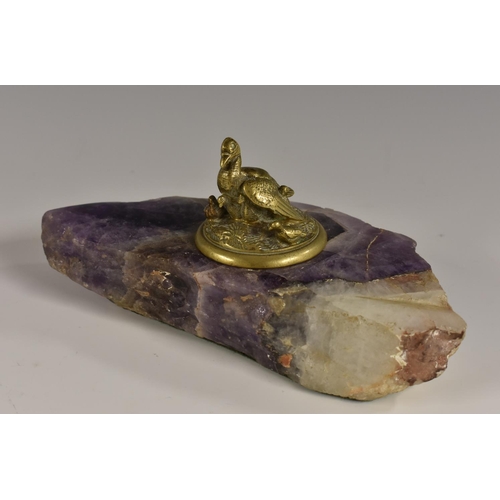 3058 - A bronze mounted mounted amethyst quartz inkwell, the cover cast as a waterfowl and young, 18cm wide