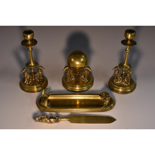 3063 - A comprehensive Victorian brass country house desk suite, comprising a globular inwell, a pen tray, ... 