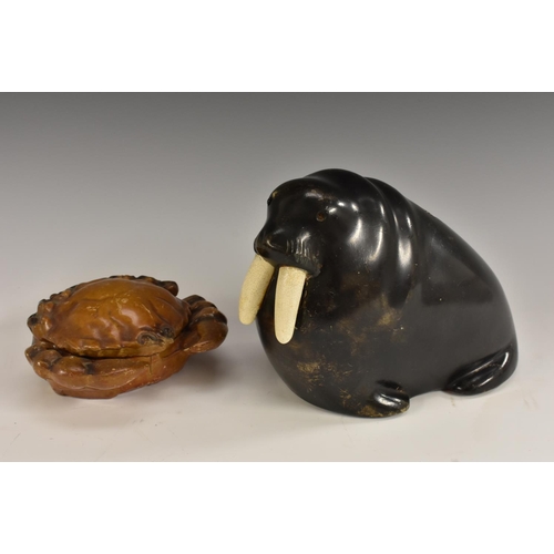 3065 - A Continental terracotta composition novelty money box, as a walrus, 15cm high, early 20th century; ... 