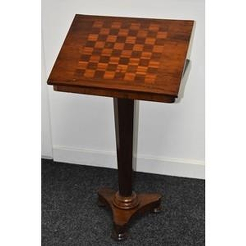 3076 - A George IV rosewood combination games and reading table, the rectangular top inlaid for chess and a... 