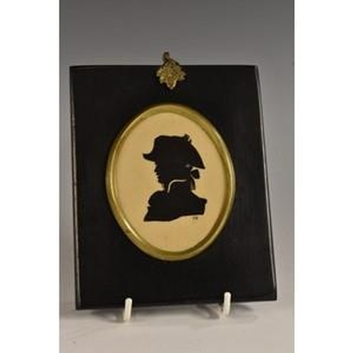 3079 - A Hadley's Worcester oval plaque, of a portrait silhouette, painted in black enamel on an ochre grou... 